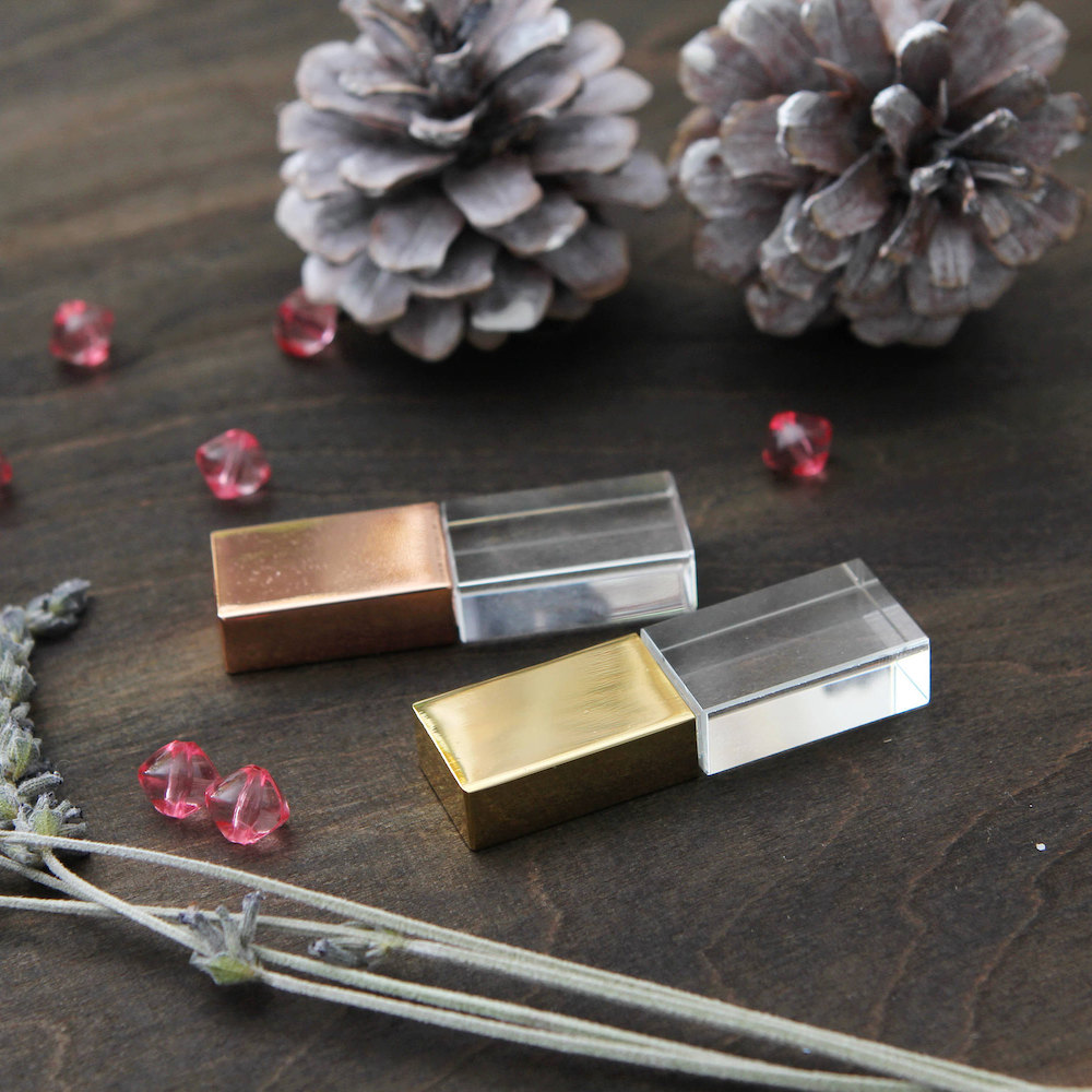 Practical holiday gifts for teachers: A gold and crystal USB drive, to store all her student's research papers on.