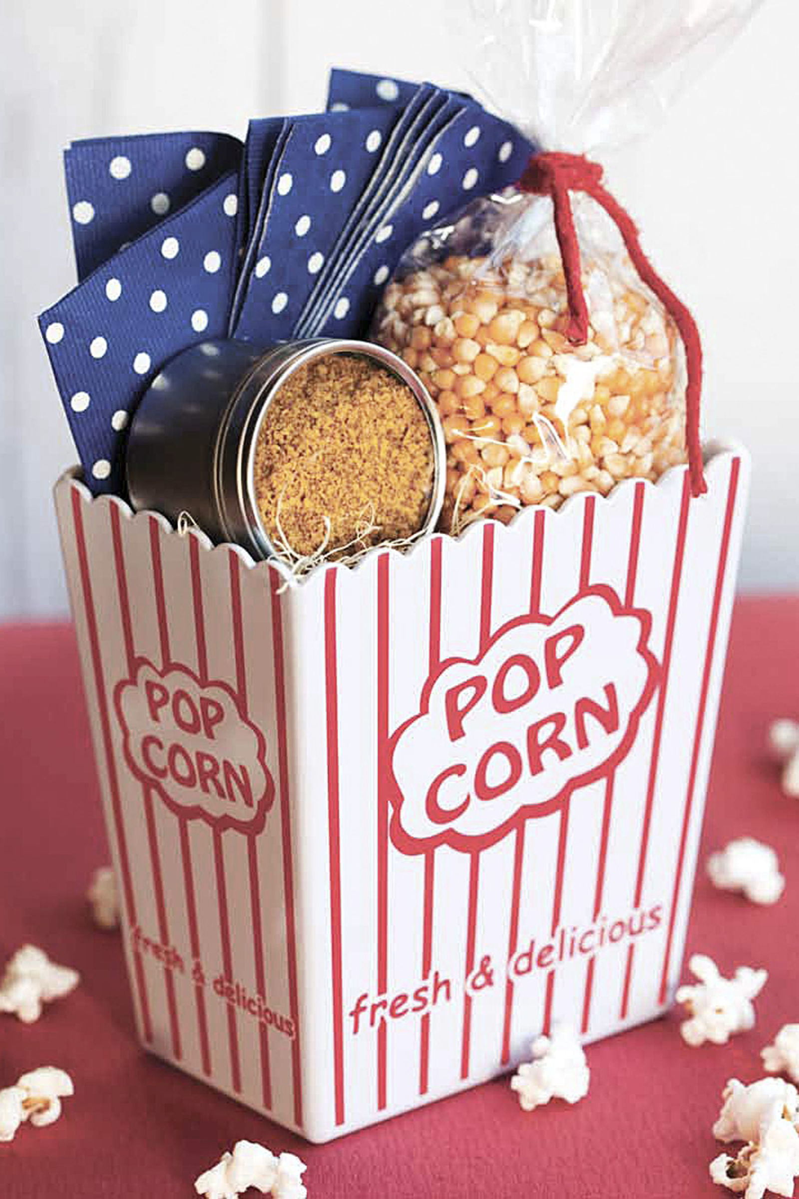How to make gift cards more special: Drop your gift card into a DIY bucket of popcorn like this by Country Living.