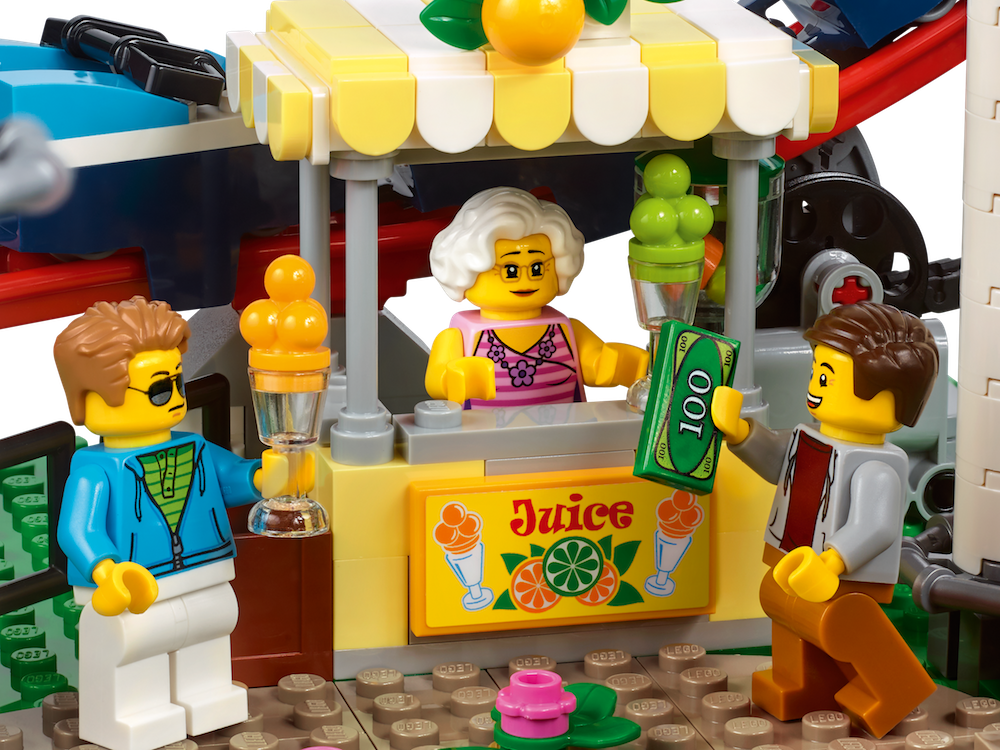 The new 1400+ piece LEGO Creator Roller Coaster set has details like a cotton candy stand
