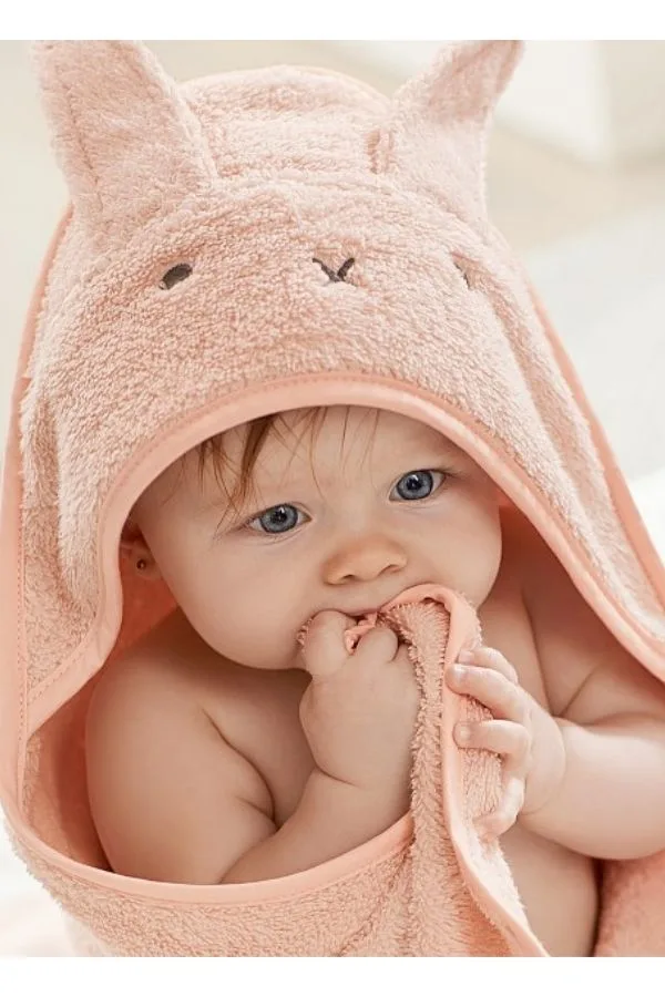 Soft baby doll has bunny ears and smells like vanilla