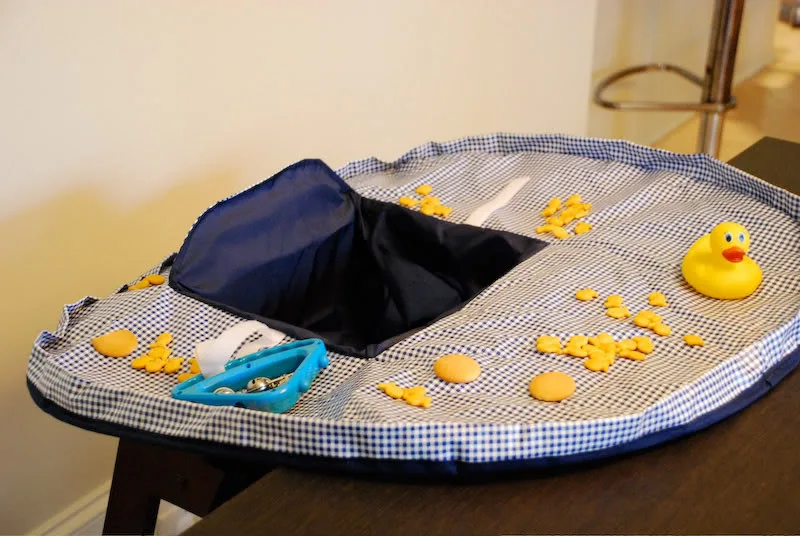 The Neatnik Saucer - A better option than high chair covers the size of a schoolbus