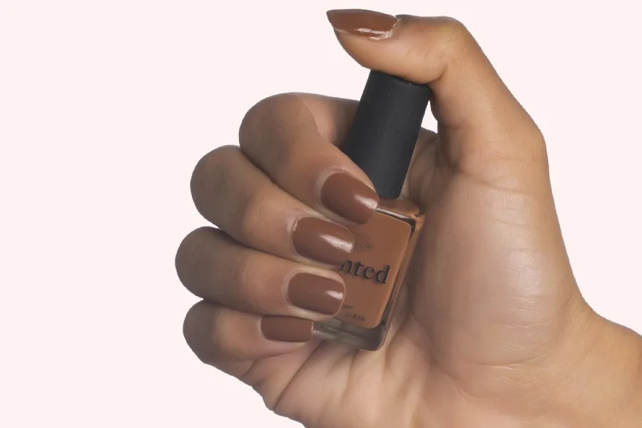 Our Favorite Spring 2022 Nail Trends includes the natural and nude shades for every skin tone, like Mented Brown & Bougie polish