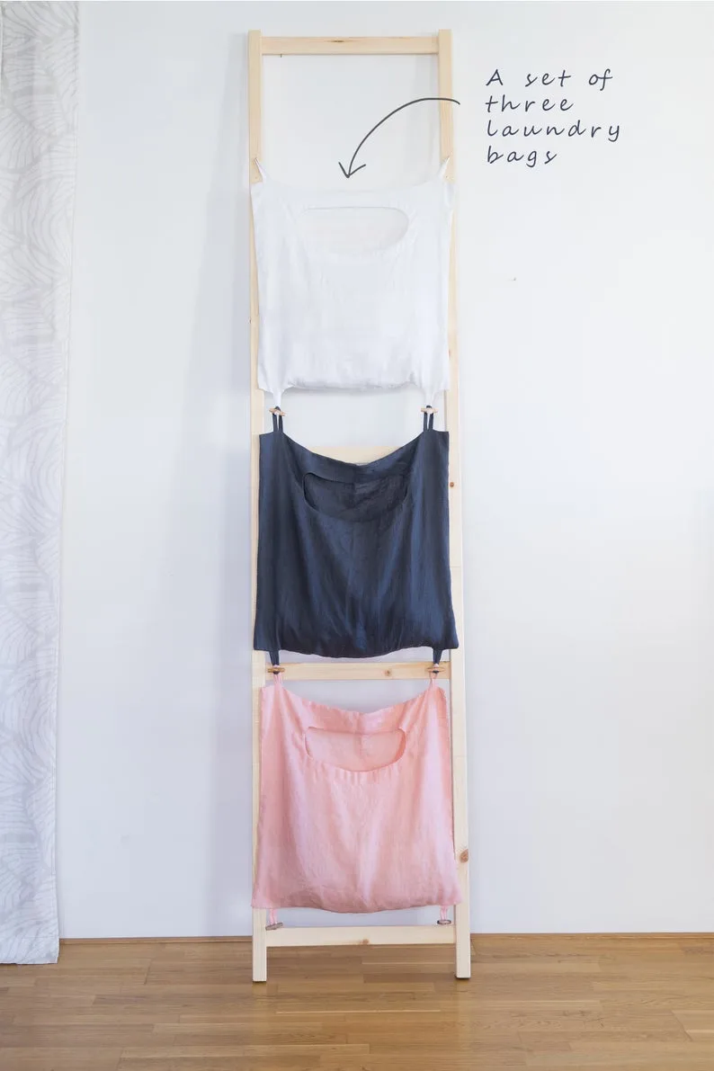 Small space solutions that get things off the floor: The stacked linen laundry bag set can be wall mounted
