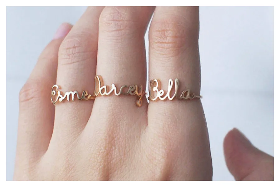 Pamper a new mom in your life with an awesome Mother's Day gift, like this custom name ring at Grace Personalized.