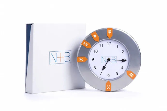 N+B Toys Doin' Time clock helps kids stay on track with little magnetic tabs for morning and evening responsibilities