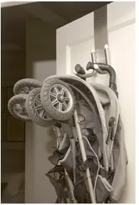 Small apartment solution: Hang the stroller. Duh.