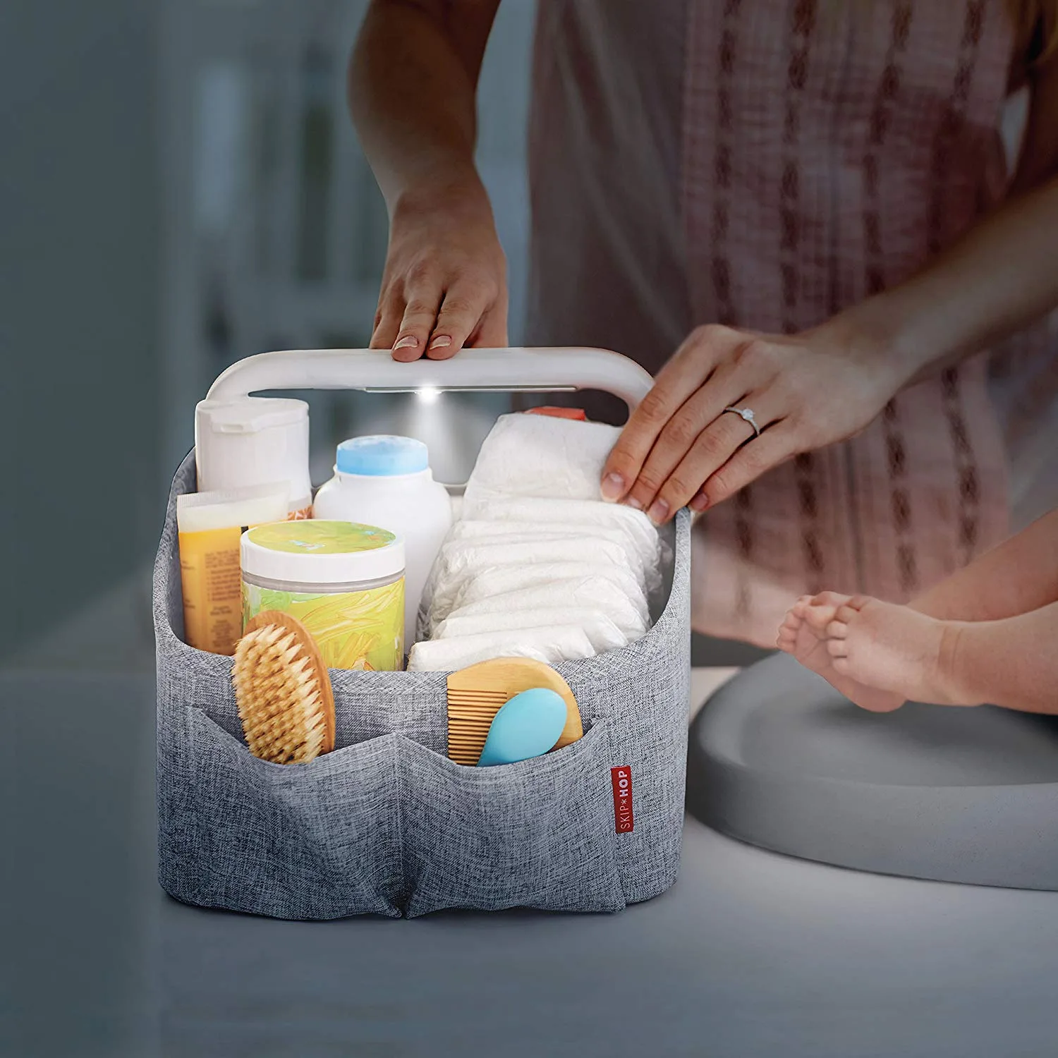Best gear for twins: The Skip Hop light-up diaper caddy makes it easy to find what you need without waking up both babies.