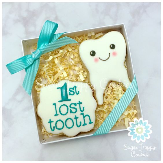 Adorable Tooth Fairy Traditions | Tooth Cookie Gift by Sugar Happy Cookies | Cool Mom Picks