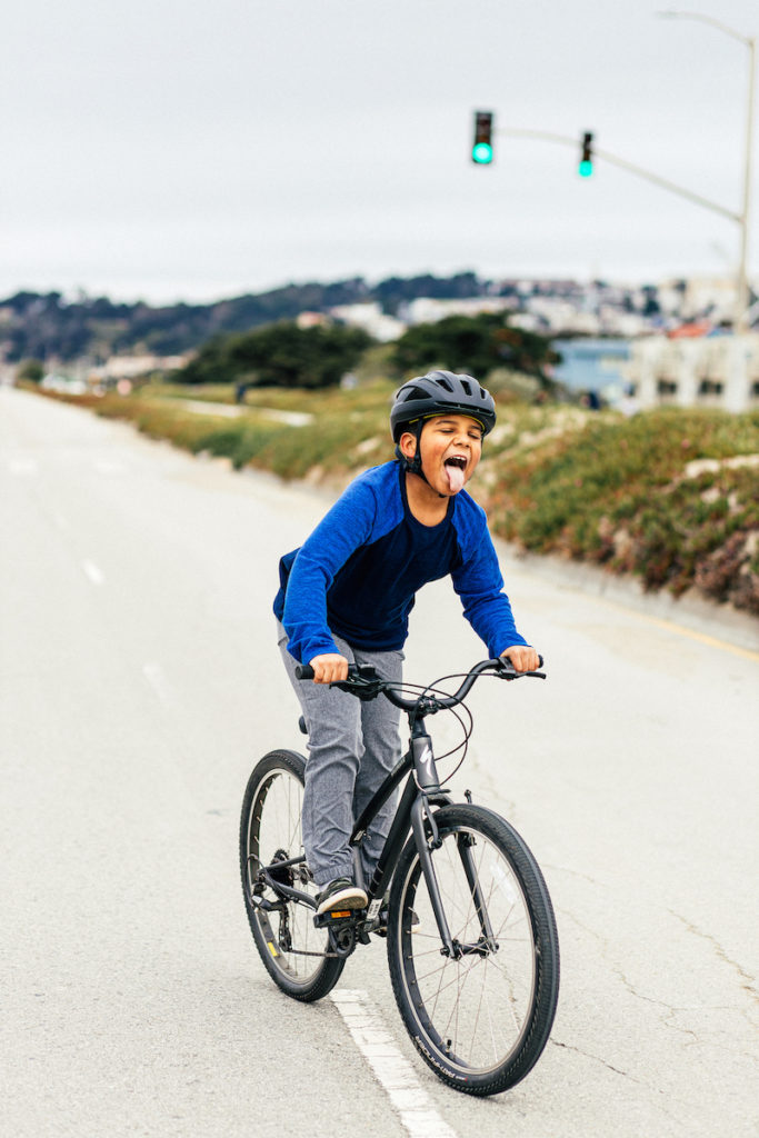 Riding on the new Specialized Jett Bicycle which can be adjustable to grow with kids