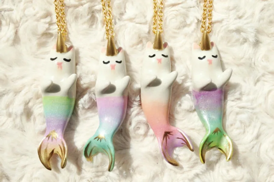 Cat-mermaid necklaces by AGirlAndHerCat. Simply purrfection.