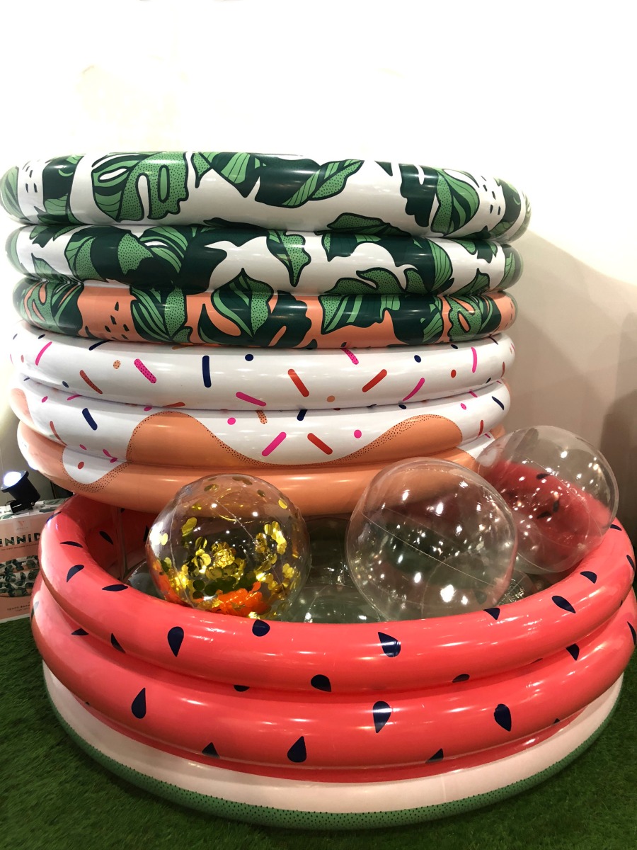 Minnidip modern inflatable pools in modern patterns like watermelons, donuts and tropical banana leaves