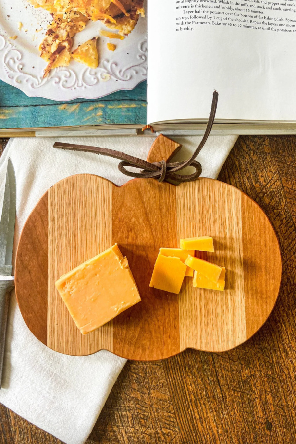 Fall decor from Etsy under $50: Pumpkin shaped wooden charcuterie board