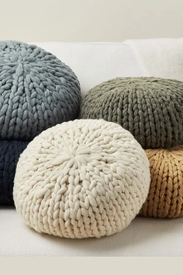 Handknit throw pillows from Pottery Barn can update the look of a couch