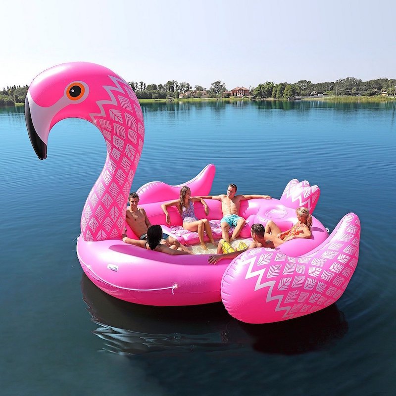 The giant flamingo pool float is more like a boat, holding 6 people