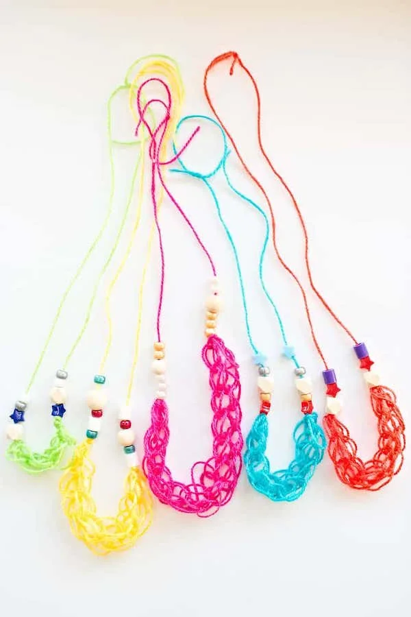 They can make a bunch of these finger knitting necklaces for friends with instructions from Hello Wonderful